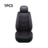 A single black leather car seat cover featuring red stitching and an emblem, designed for universal fit.