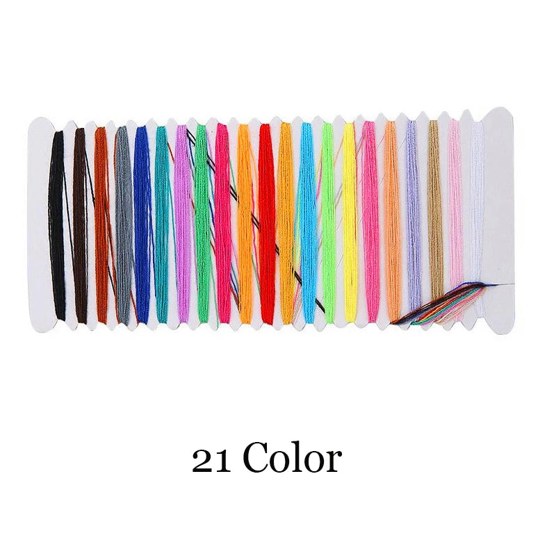 A strip of 21 colored embroidery threads laid out horizontally for creative hand embroidery stitches.