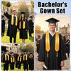A male graduate in a black gown and yellow hood stands next to a female graduate in a black gown and yellow hood.