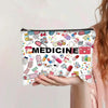 A pink canvas charger storage pouch filled with various colorful medicine and first aid items.