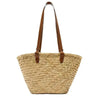 Handwoven straw tote bag with brown leather handles