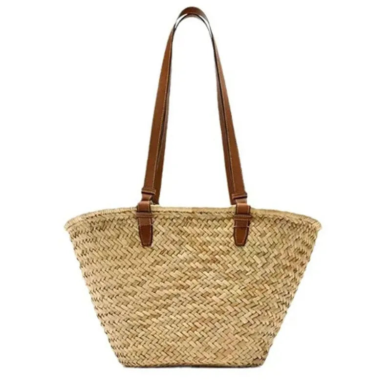 Handwoven straw tote bag with brown leather handles