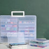Clear photo storage boxes containing various pictures and mementos