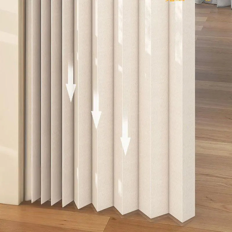 A vertical beige door curtain with vertical pleats and a translucent fabric, shown in a modern interior setting.