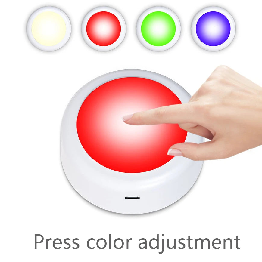 A hand presses a red button on an RGB LED under cabinet light remote control, demonstrating color adjustment.