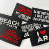 A collection of black embroidered iron-on patches with text such as VIOLENCE AND CHAOS and I AM AR
