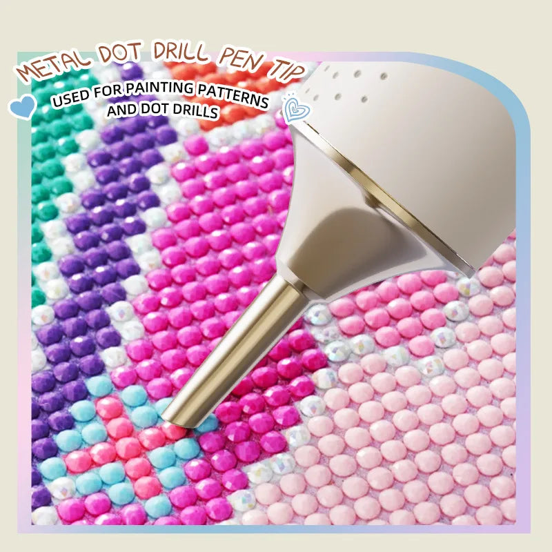 A silver metal dot drill pen tip used for painting patterns and dot drills on a colorful surface.