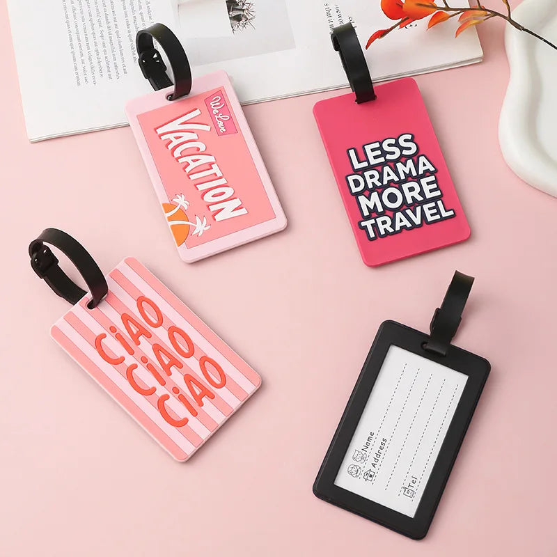 Pink and black silicone luggage tags featuring vacation and ciao designs