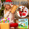 A girl is holding a wooden box and a red gift, with a colorful Pop Mini keychain toy set visible.