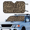 Leopard print car windshield sunshade placed on a white pickup truck.