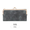 A grey vintage kiss lock long wallet with a gold-toned clasp.