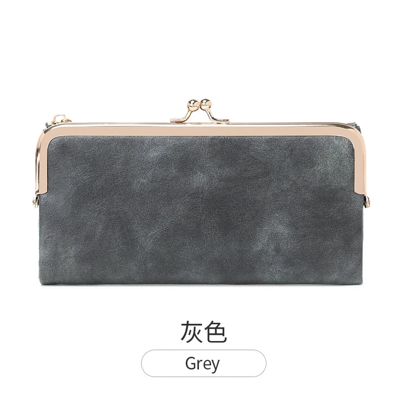 A grey vintage kiss lock long wallet with a gold-toned clasp.