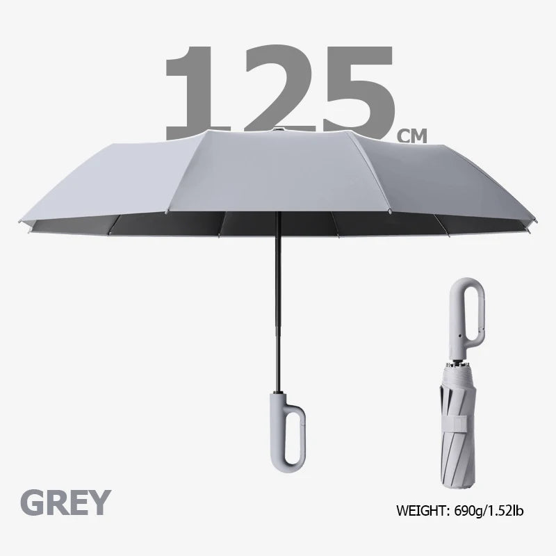 A grey windproof reverse folding umbrella with a reflective stripe and carabiner handle.