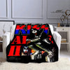 A black flannel throw blanket featuring a graphic print of the Kiss band logo and members.