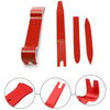 A set of red car trim removal tools shown in various shapes and angles.