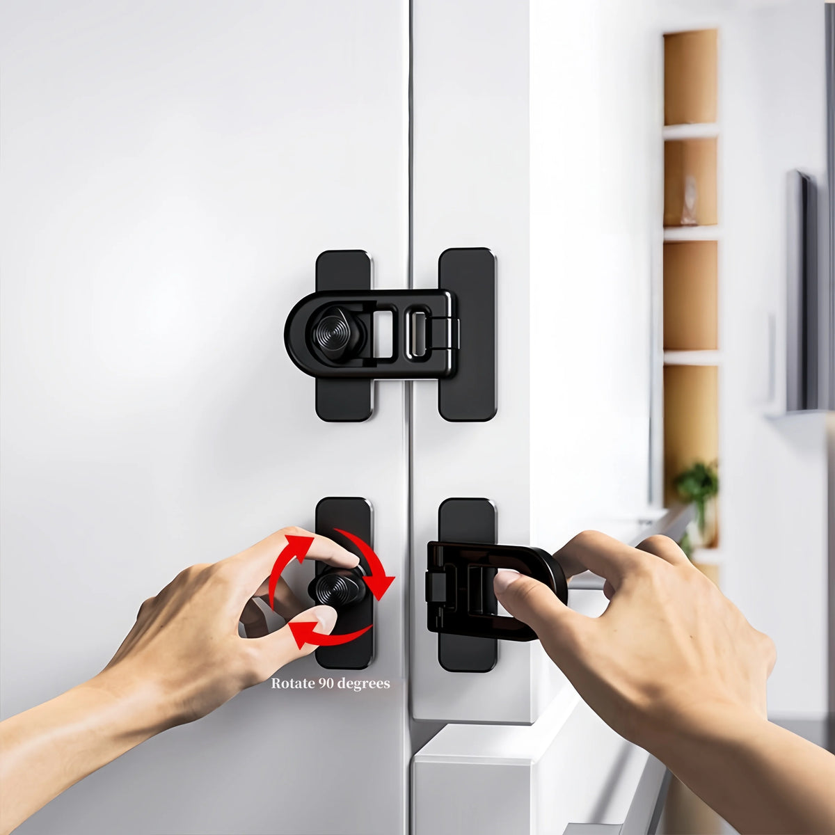A hand rotates a black non-drill child safety door lock onto a white appliance cabinet door.