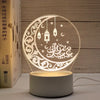 A glowing moon design acrylic night light featuring Arabic calligraphy and stars, powered by a USB cable.