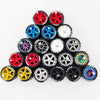 A collection of ten pairs of 1:64 scale alloy car wheels and tires in various colors and finishes.