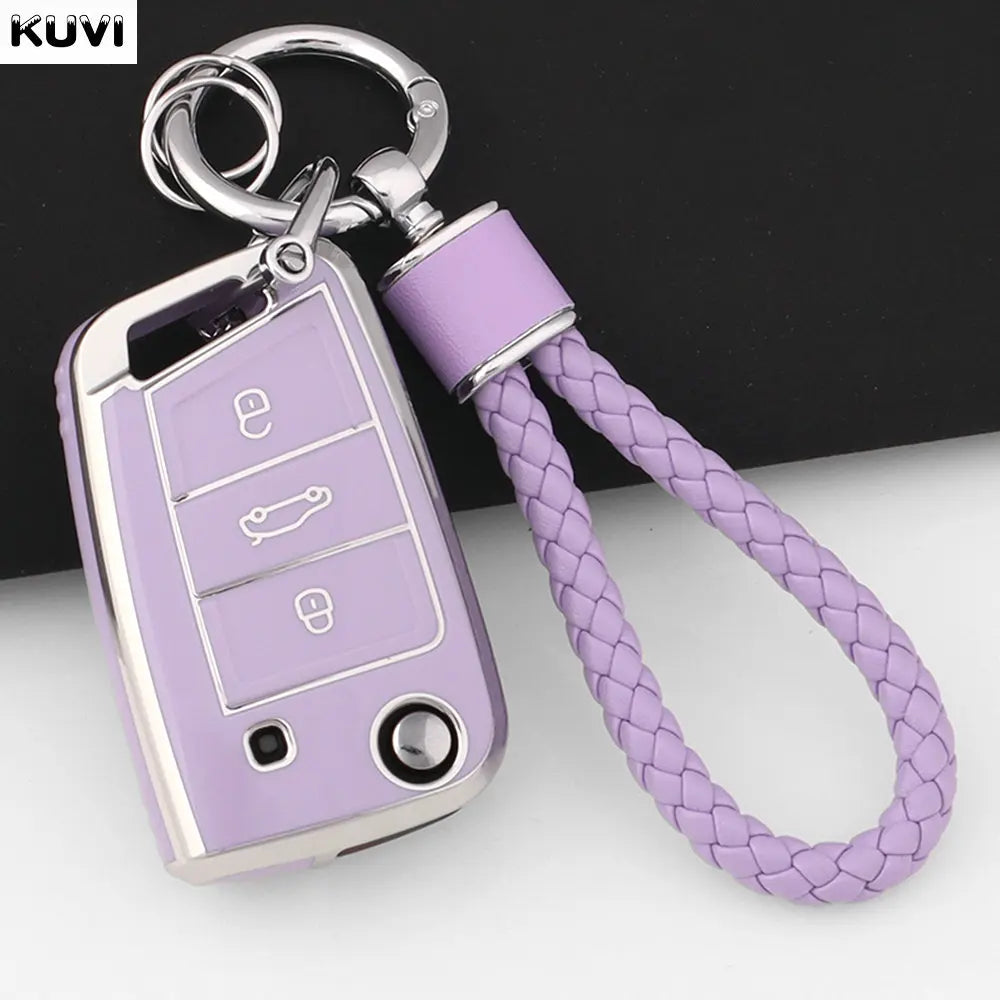 A purple TPU car key fob cover with a silver keyring and lanyard is shown against a white background.