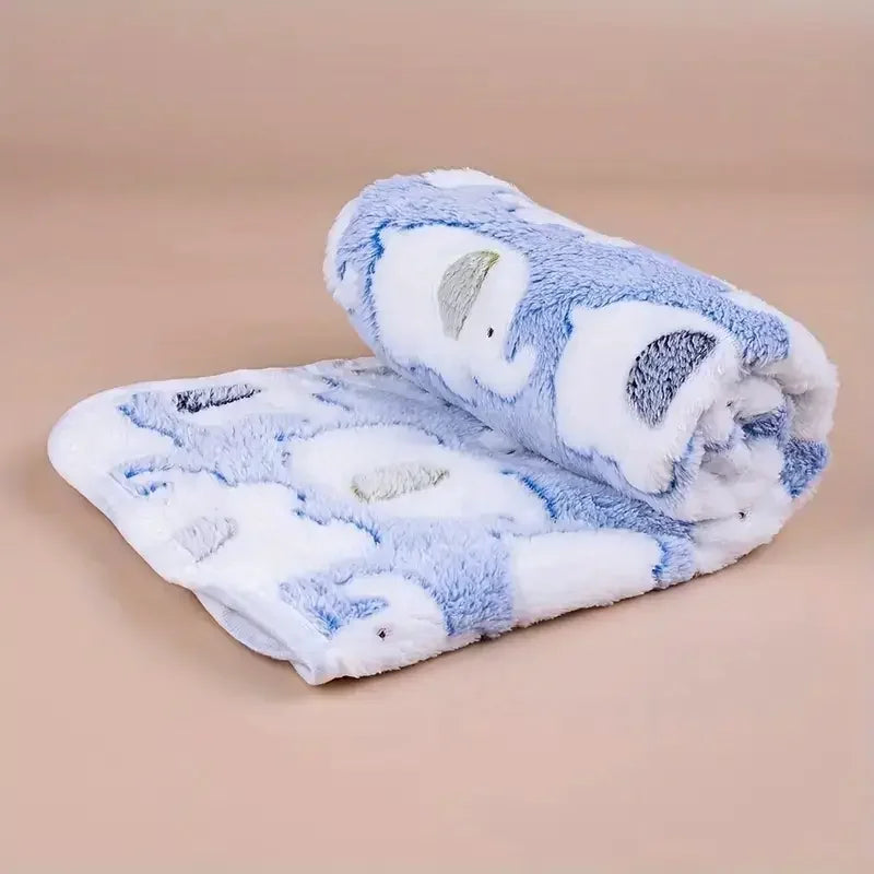 A fluffy blue and white flannel pet blanket featuring a cartoon elephant design for dogs and cats.