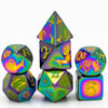 A set of seven metal polyhedral dice featuring a dragon font design in iridescent purple and green colors.