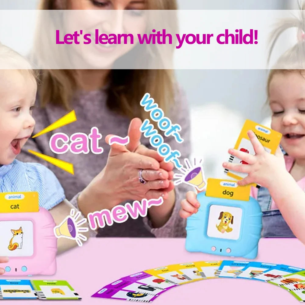 A woman is teaching a child to interact with a talking flash card learning toy featuring cat and dog sounds.