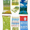A collection of embroidered cartoon face towels featuring nature scenes, including forests, fields, and landscapes.