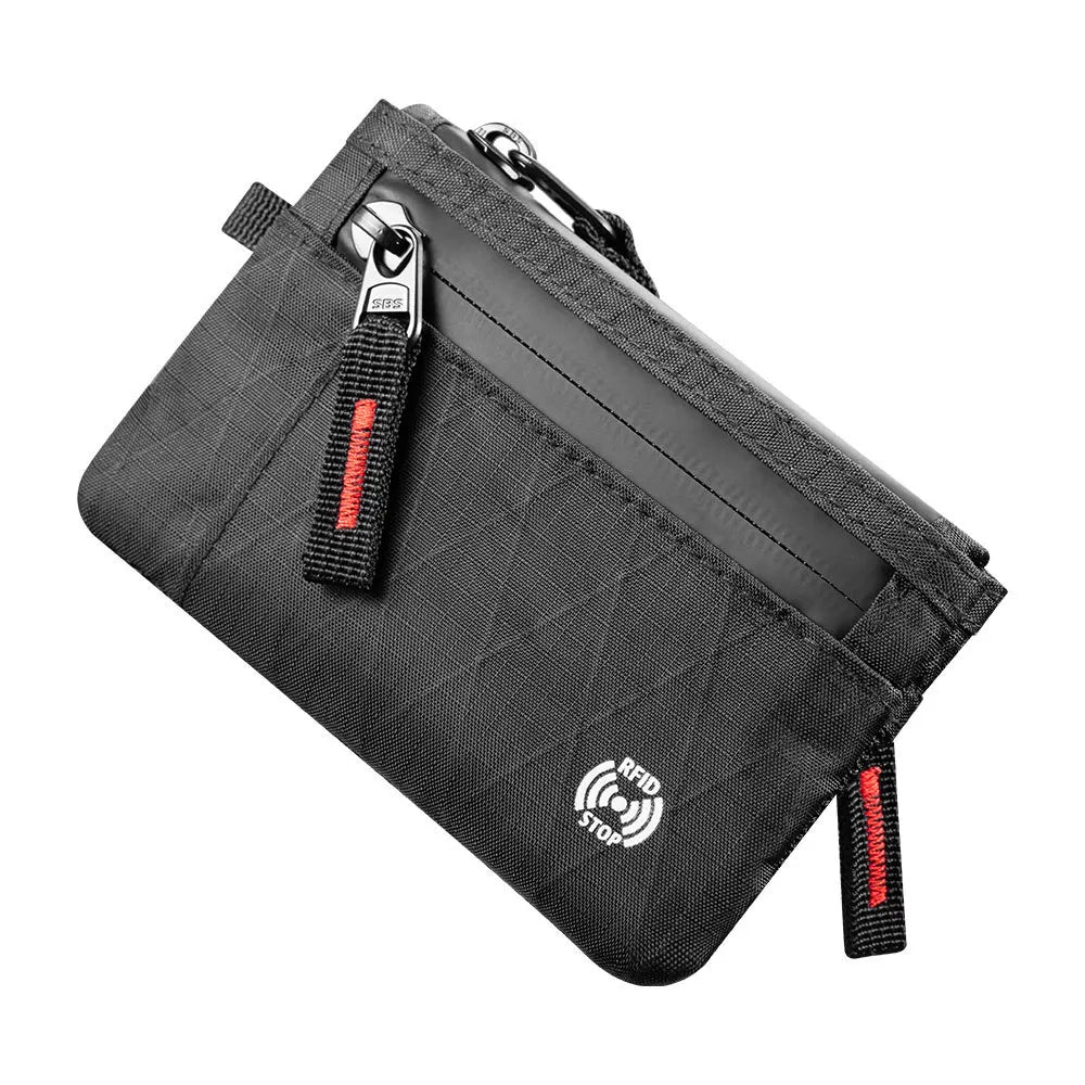 A black RFID-blocking travel wallet with a carabiner clip attached to the side.
