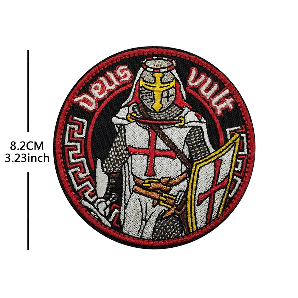 Embroidered patch featuring a crowned knight with a cross and sword, surrounded by the text Deus vult.