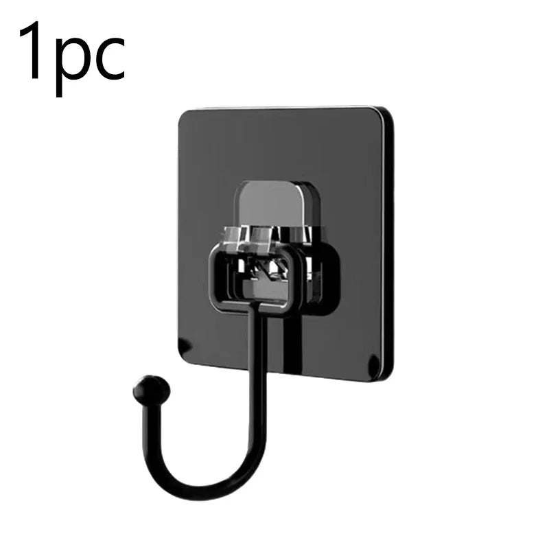 A black adhesive hook with a curved metal loop attached, used for kitchen or bathroom storage.