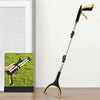 A long, black and yellow foldable grabber tool is shown against a white wall with a close-up inset of its use.