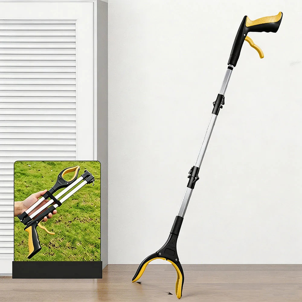 A long, black and yellow foldable grabber tool is shown against a white wall with a close-up inset of its use.