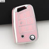 A pink TPU car key cover for VW, SEAT & Skoda models showing various key cutouts and a camera lens.