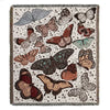 A woven throw blanket featuring a bohemian pattern of various butterflies in earthy tones on a neutral background.