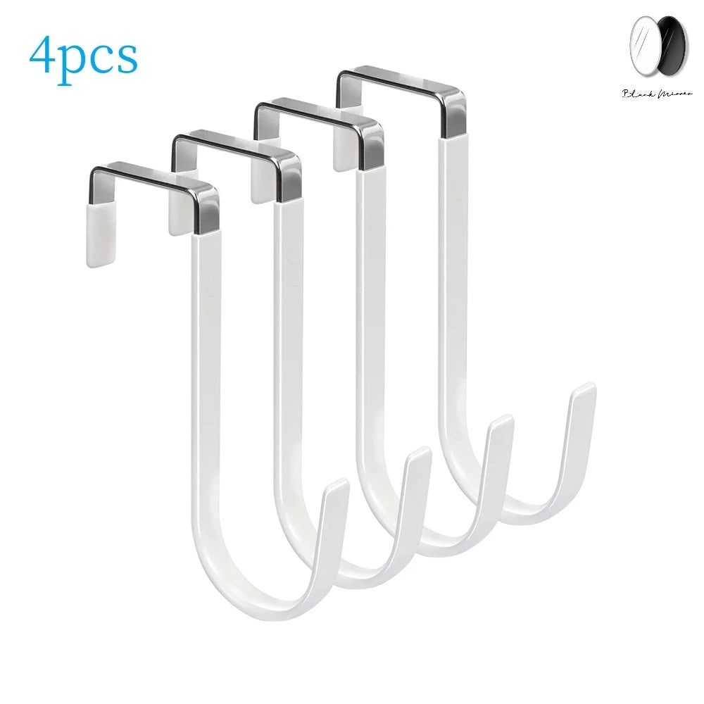 A set of four white over-the-door hooks with soft rubber coating.