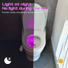 A toilet with a light activated by a human body sensor, showing purple illumination.