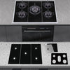 A kitchen setup showing a stovetop and a built-in oven, with several black reusable non-stick gas stove protector mats on the