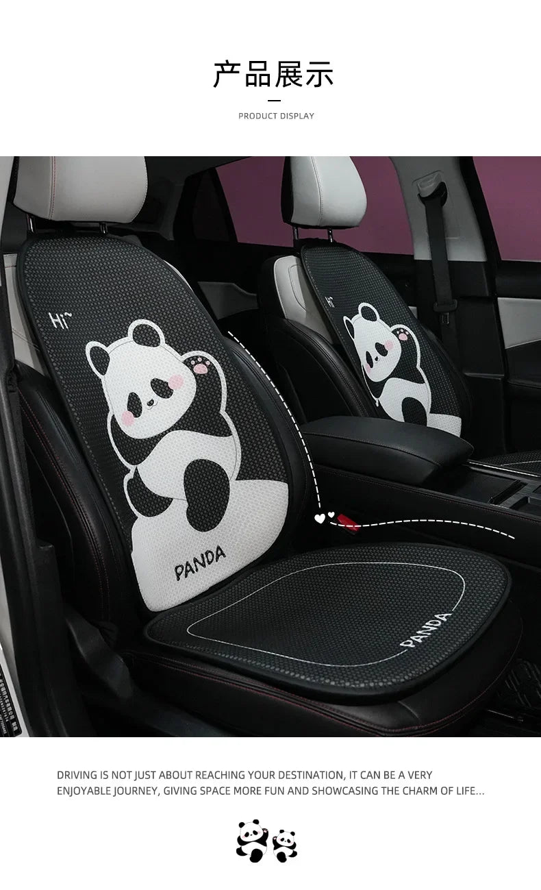Black car seat covers featuring panda designs and headrest pillows installed in a vehicle interior.