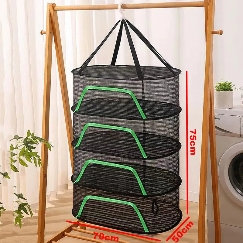 A folding wooden rack displays a cylindrical black mesh drying net with green accents.