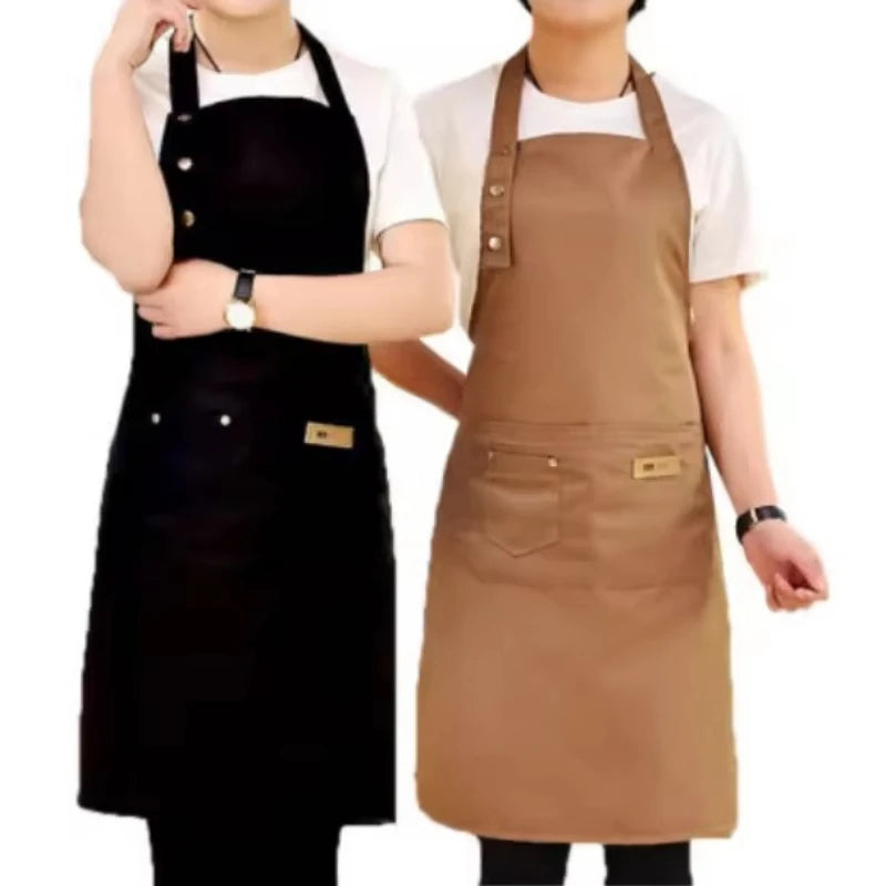 Two people wearing adjustable cotton aprons, one black and one brown, standing side by side.