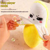 A hand is touching the skin of a white plush bear toy to play a note, demonstrating a two-player mode.