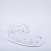 White plastic cap protector cage designed for washing machines.