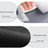 Close-up of a grey bath mat showing its texture and rubber bottom, with text indicating 7 Colour Home.