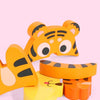 A set of three wooden puzzle pieces shaped like cartoon tigers in orange and yellow colors.