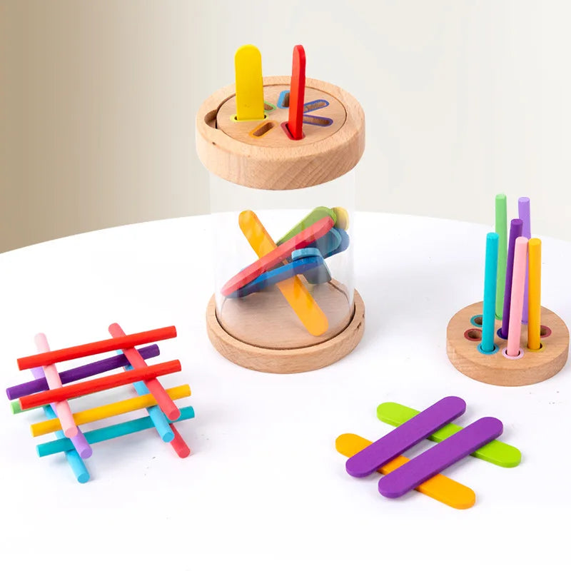 A wooden color sorting toy for toddlers featuring colorful wooden sticks and a clear container.