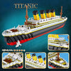 A detailed LEGO model kit of the Titanic ship, featuring white and black hull with yellow funnels.