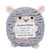 A handmade gray sheep crochet doll with fluffy ears and a card that reads I may be a tiny sheep but I believe in you Go do yo