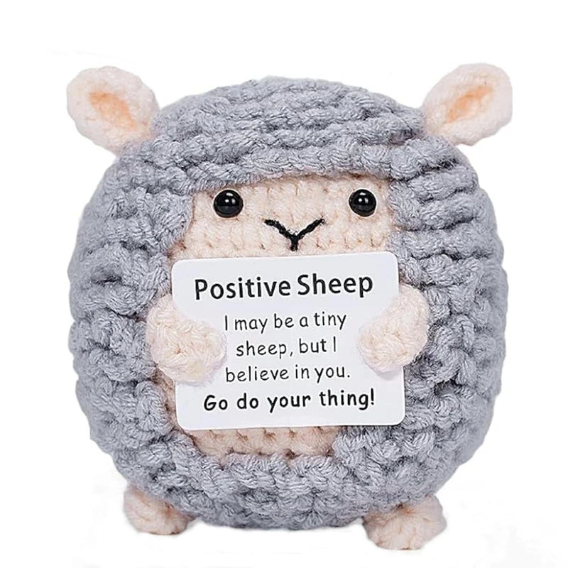 A handmade gray sheep crochet doll with fluffy ears and a card that reads I may be a tiny sheep but I believe in you Go do yo