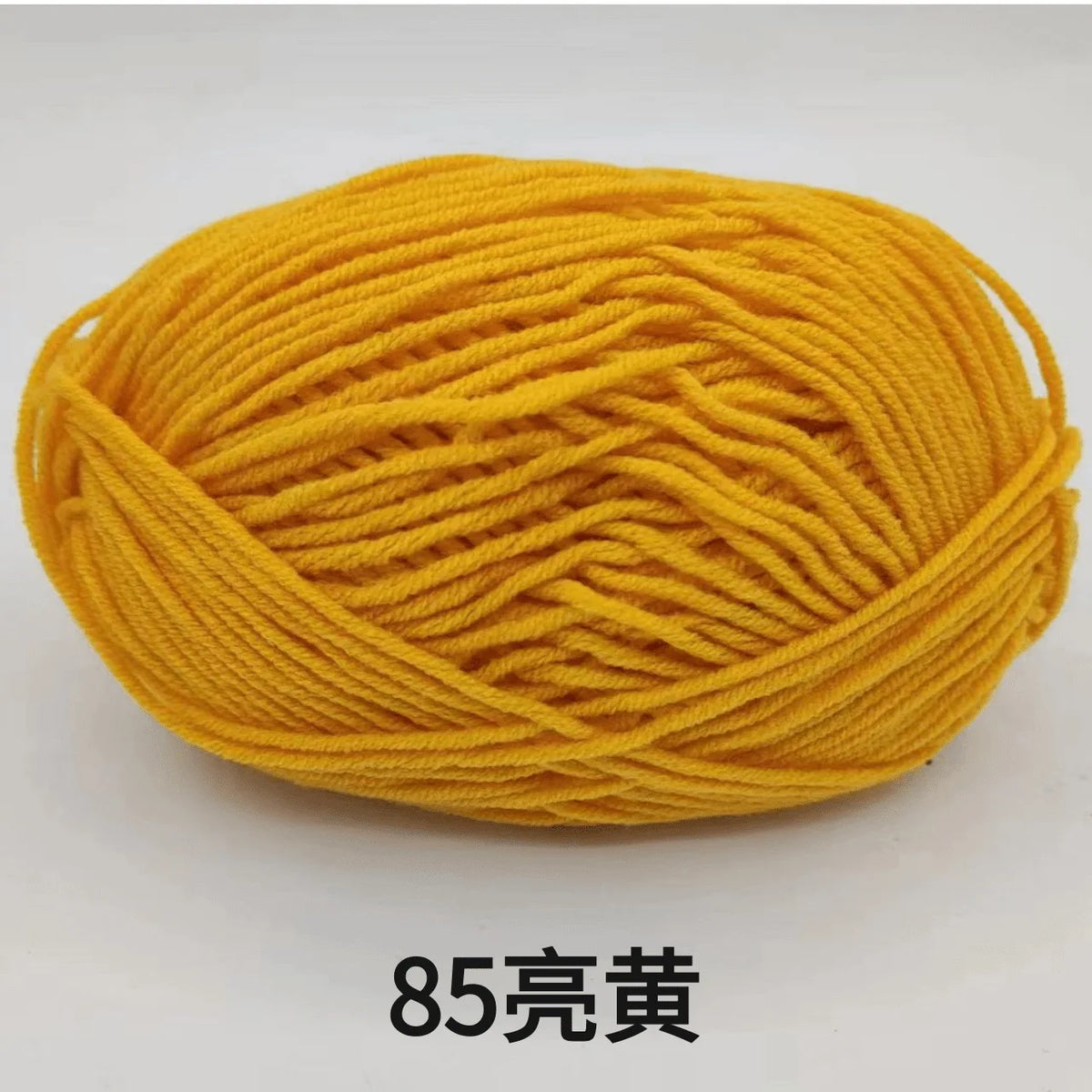 A ball of bright yellow 85-count cotton yarn for knitting and crochet.