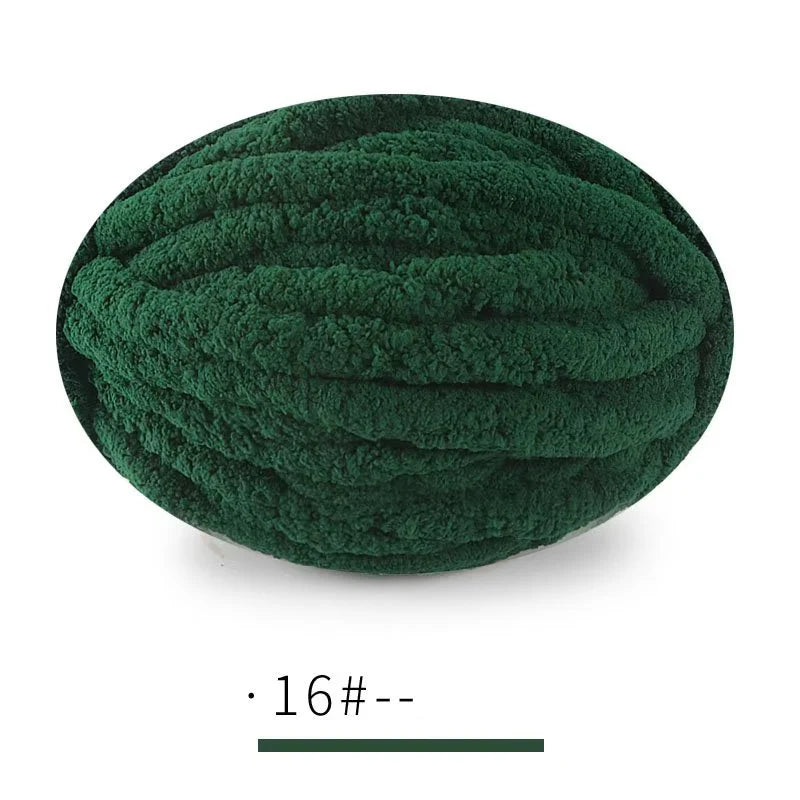 A ball of dark green extra thick chenille yarn for hand knitting projects.
